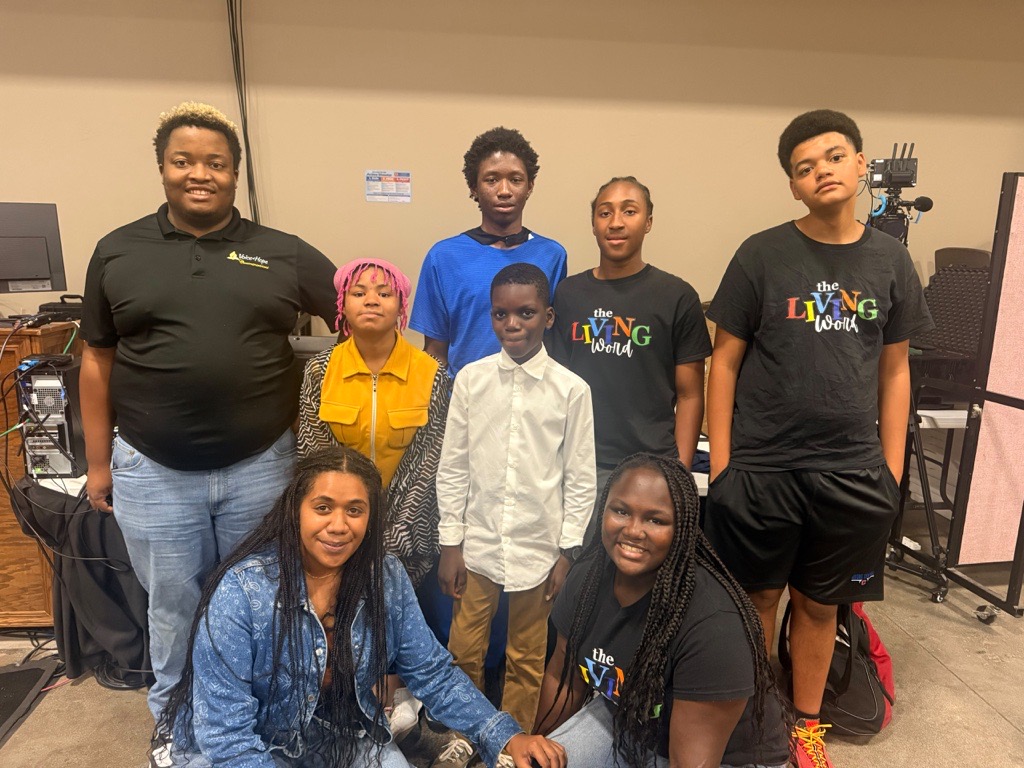 Young media team managing event coverage at Voice of Hope