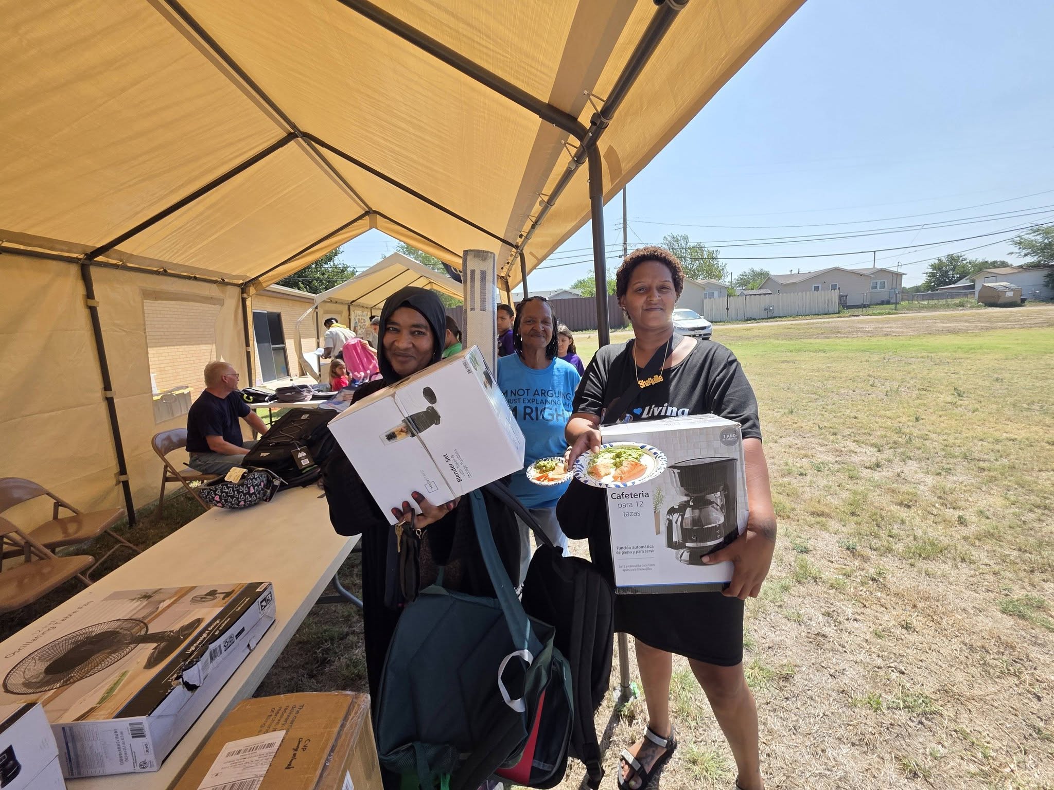 Families receiving resources at the health fair